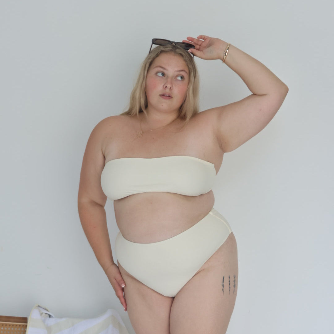 Blue Apparel eco-friendly swimwear in biodegradable packaging, showcasing the brand's commitment to plastic-free fashion and sustainability.